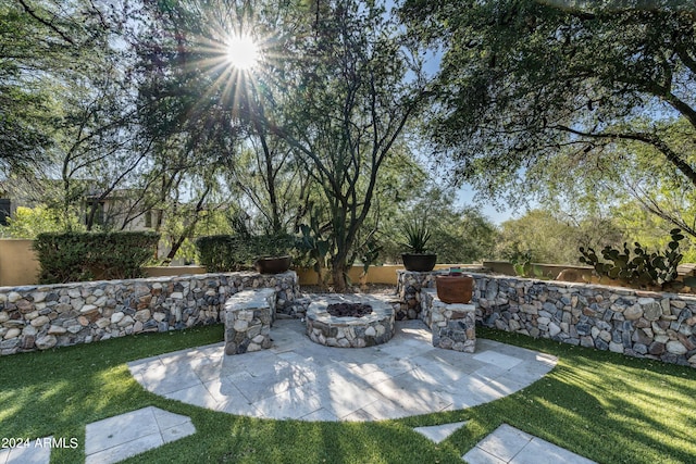 view of yard with a patio and an outdoor fire pit