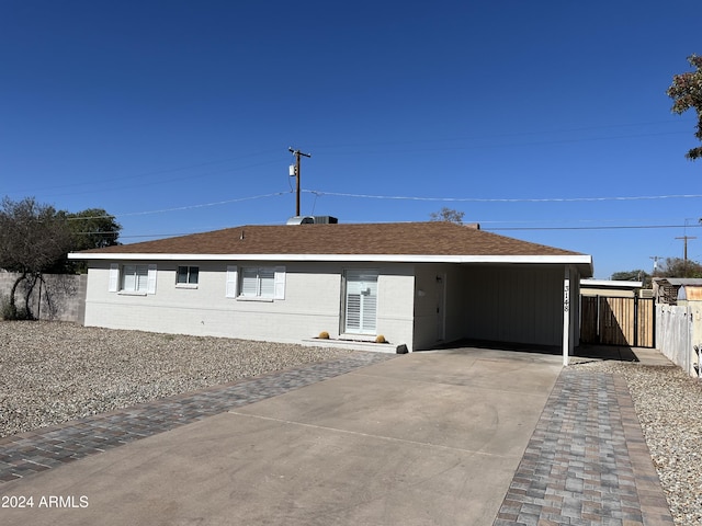 ranch-style house with a carport