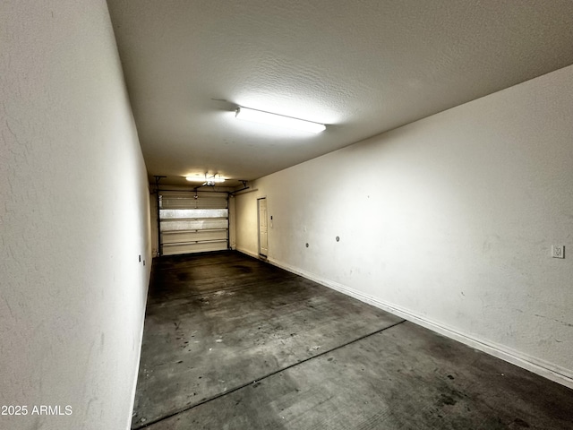 garage featuring baseboards