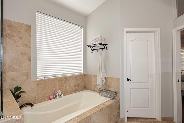 bathroom featuring tiled bath