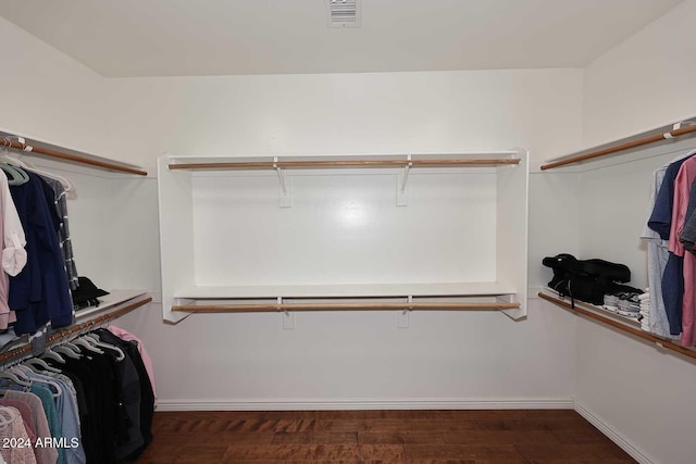 walk in closet featuring dark hardwood / wood-style floors