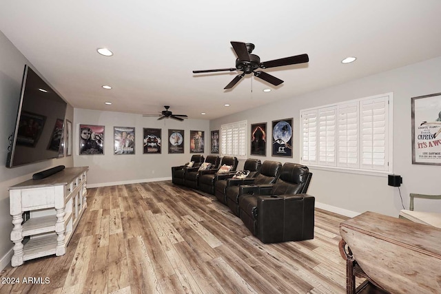 living room with hardwood / wood-style floors and ceiling fan