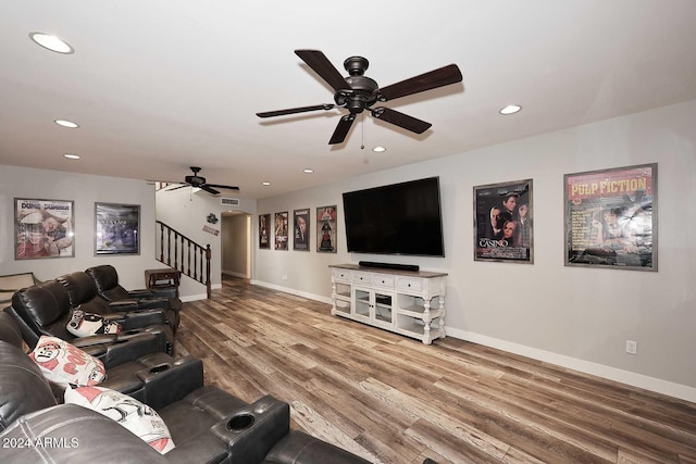 living room with hardwood / wood-style floors and ceiling fan