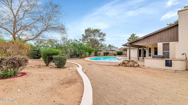 view of swimming pool featuring a fenced in pool, a patio area, and fence