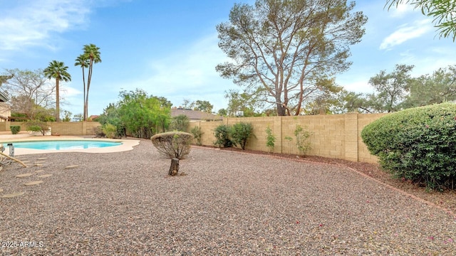 exterior space featuring a patio area, a fenced backyard, and a fenced in pool