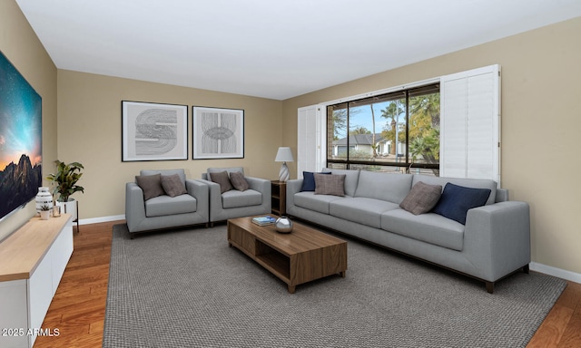 living room with wood finished floors and baseboards