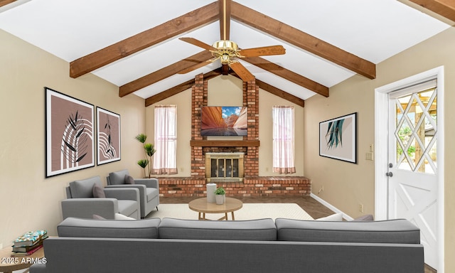 living room with lofted ceiling with beams, a brick fireplace, and ceiling fan