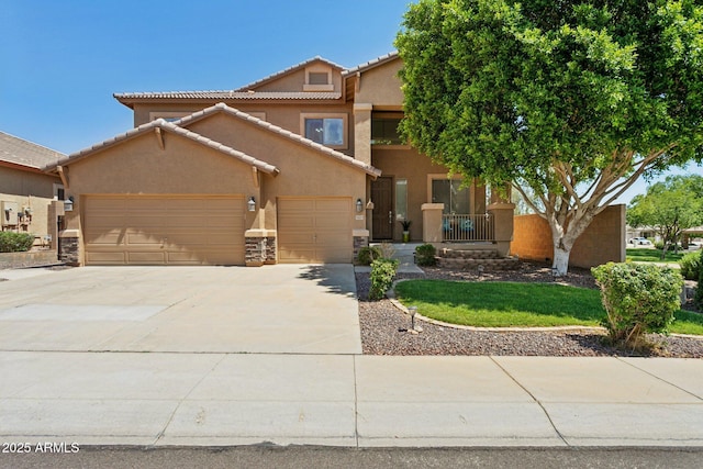 13724 W Luke Ave, Litchfield Park, AZ 85340 - view of front of property featuring stucco siding, a garage, concrete driveway, a tiled roof, and stone siding