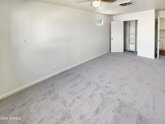 unfurnished bedroom with ceiling fan, carpet flooring, baseboards, and visible vents
