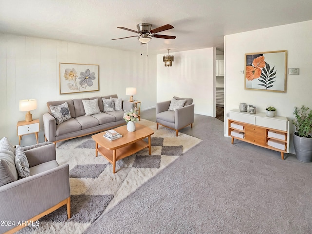 carpeted living room featuring ceiling fan