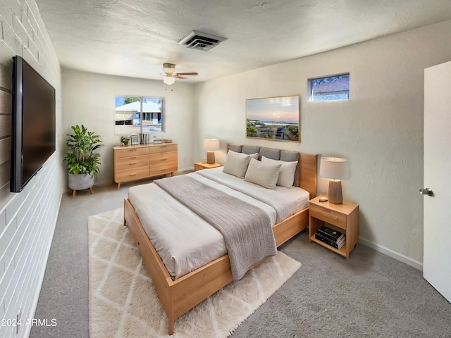 bedroom with visible vents, baseboards, a ceiling fan, and carpet