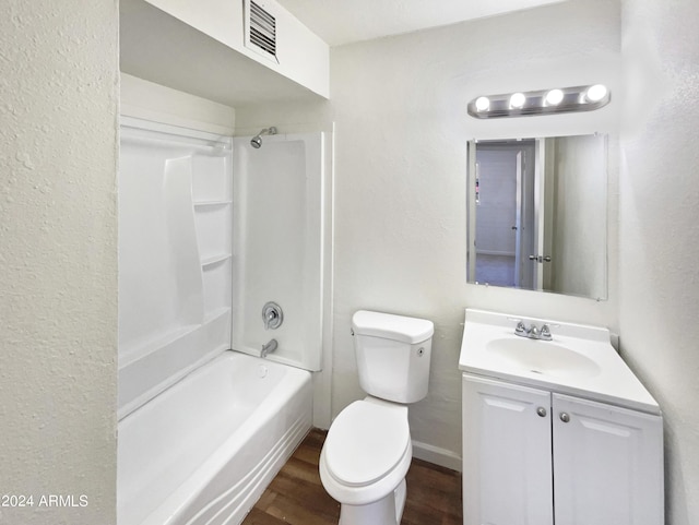 bathroom with vanity, bathing tub / shower combination, toilet, visible vents, and wood finished floors
