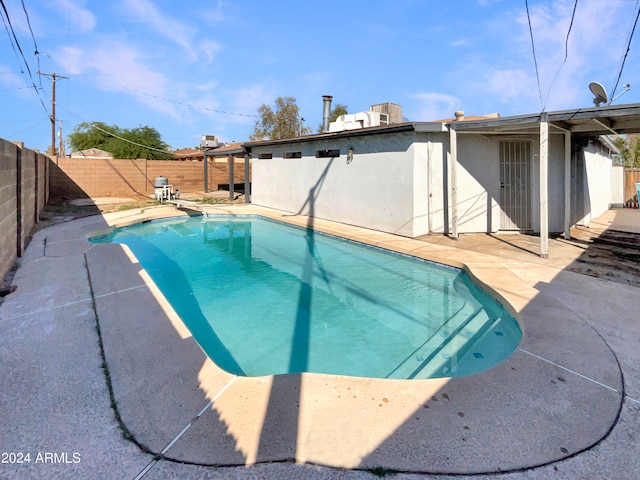 view of swimming pool featuring a patio area