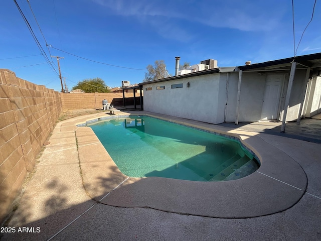 view of pool featuring a patio area, a fenced backyard, and a fenced in pool