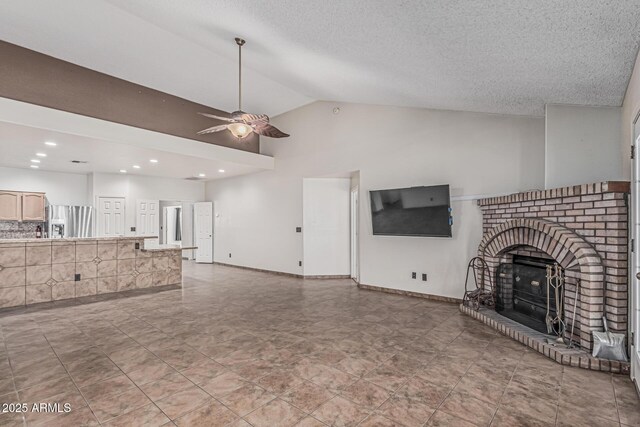 4207 W Soft Wind Dr, Glendale, AZ 85310 - unfurnished living room with ceiling fan, a brick fireplace, high vaulted ceiling, and recessed lighting