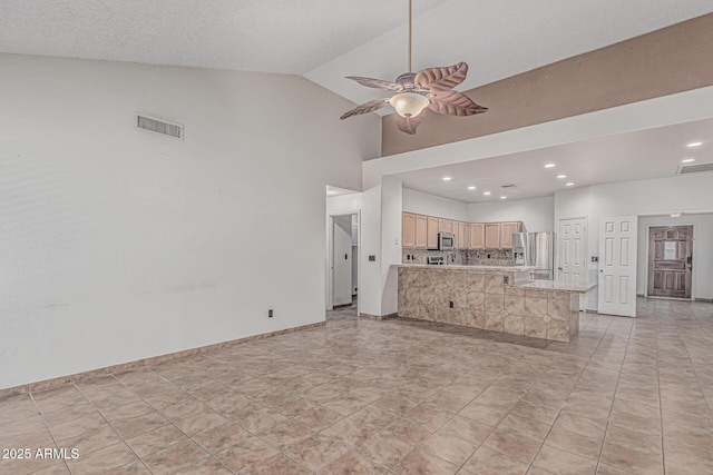 4207 W Soft Wind Dr, Glendale, AZ 85310 - unfurnished living room with ceiling fan, high vaulted ceiling, recessed lighting, and baseboards
