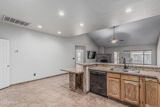 4207 W Soft Wind Dr, Glendale, AZ 85310 - kitchen with black dishwasher, a sink, plenty of natural light, a brick fireplace, and lofted ceiling