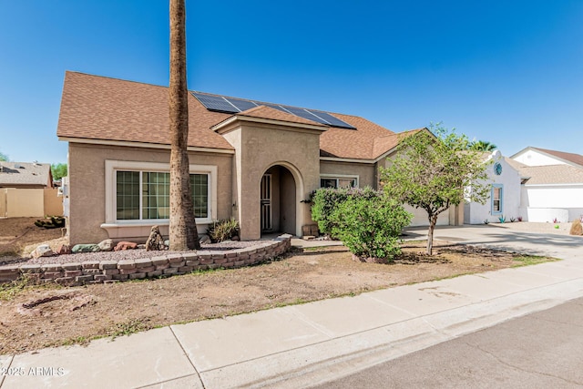 4207 W Soft Wind Dr, Glendale, AZ 85310 - traditional home featuring driveway, stucco siding, a shingled roof, solar panels, and an attached garage