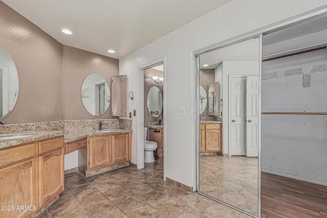 4207 W Soft Wind Dr, Glendale, AZ 85310 - bathroom with vanity, recessed lighting, and toilet