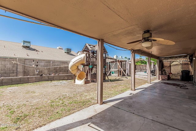4207 W Soft Wind Dr, Glendale, AZ 85310 - view of patio with a playground, a fenced backyard, and a ceiling fan