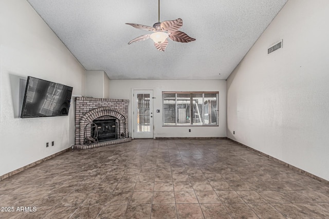 4207 W Soft Wind Dr, Glendale, AZ 85310 - unfurnished living room with a textured ceiling, a ceiling fan, a fireplace, and baseboards