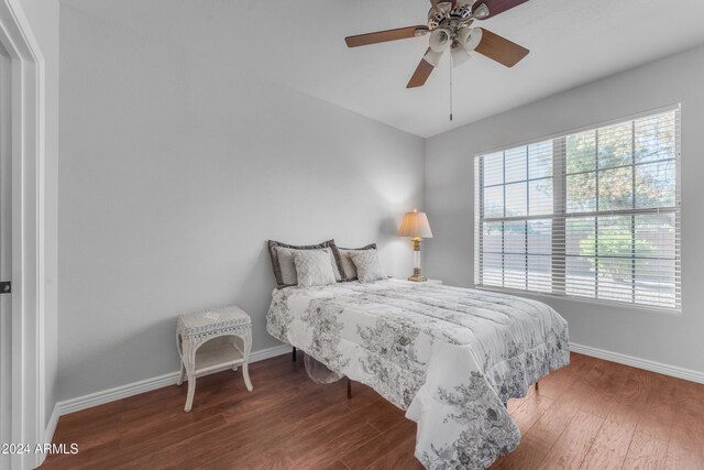 bedroom featuring hardwood / wood-style flooring and ceiling fan