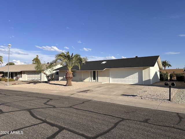 ranch-style house featuring a garage