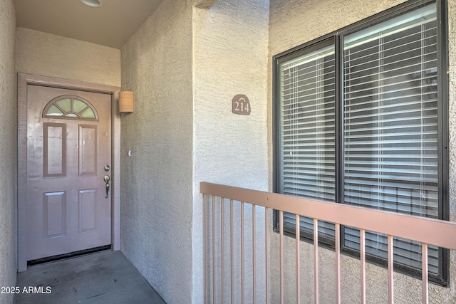 entrance to property featuring a balcony