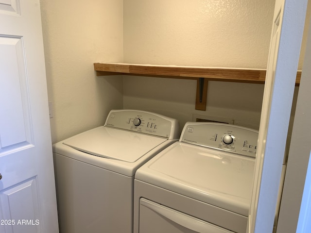 laundry room featuring washer and clothes dryer