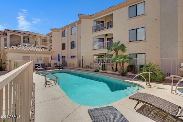 view of swimming pool featuring a patio area