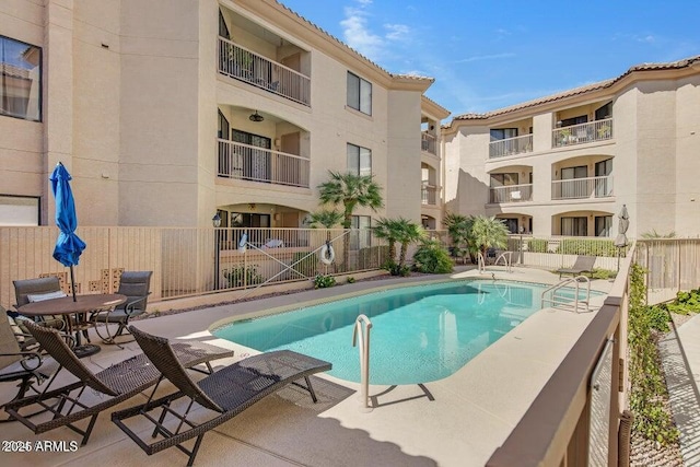 view of swimming pool with a patio