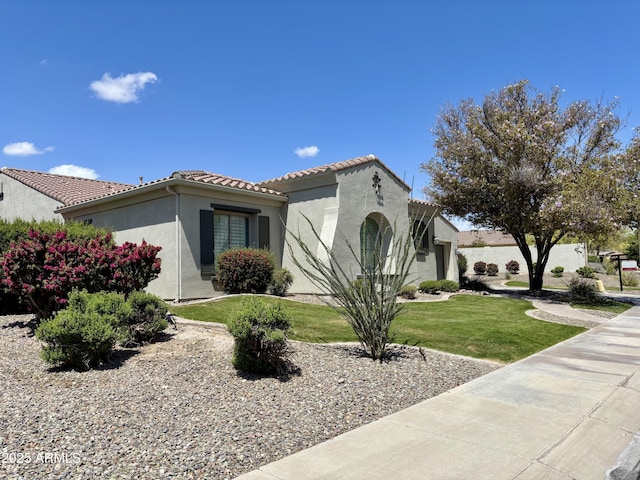 30488 N 126th Dr, Peoria, AZ 85383 - mediterranean / spanish-style house featuring stucco siding, a tile roof, a garage, and a front yard