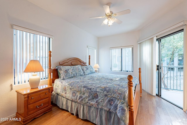 bedroom featuring light wood-type flooring, access to outside, multiple windows, and a ceiling fan