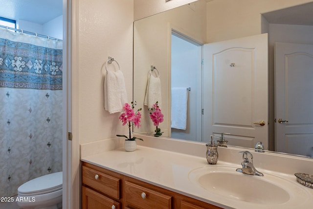 full bath featuring toilet and vanity