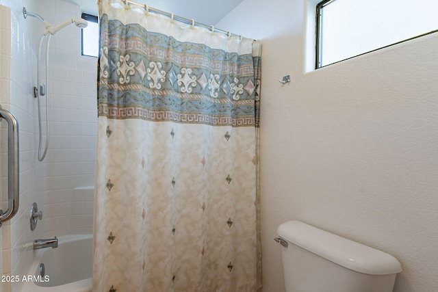 full bathroom featuring shower / tub combo and toilet