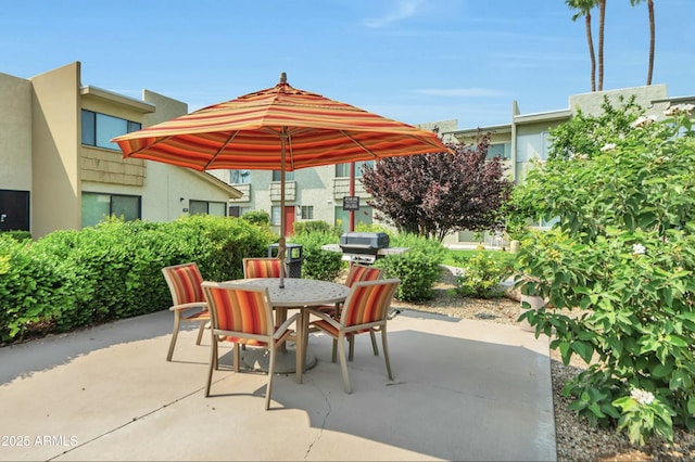 view of patio / terrace with a grill and outdoor dining area