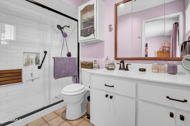 full bath with tile patterned flooring, toilet, a shower stall, and vanity