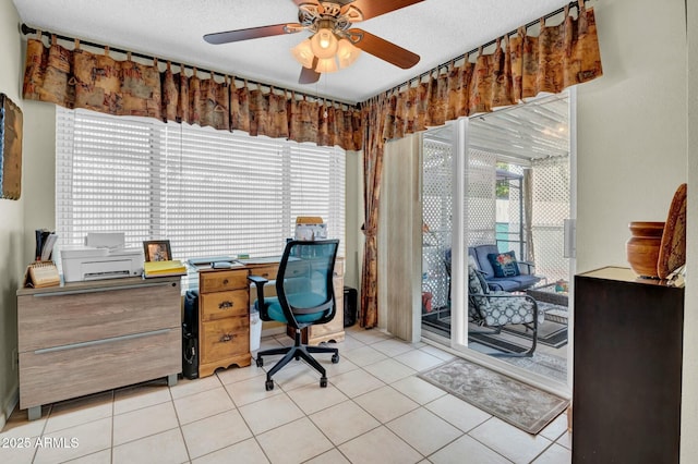 office area featuring ceiling fan, a textured ceiling, and tile patterned floors