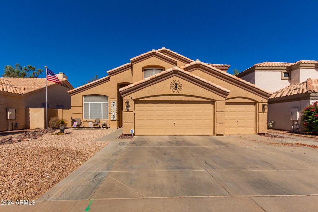 11432 W Ashland Way, Avondale, AZ 85392 - mediterranean / spanish-style home with a garage