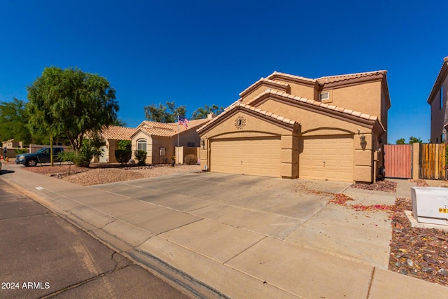 mediterranean / spanish-style home featuring a garage