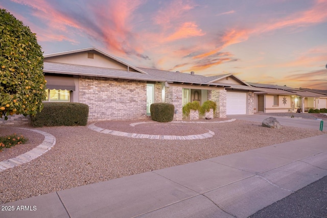 single story home featuring a garage