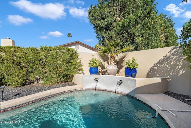 view of swimming pool with a fenced in pool and a fenced backyard