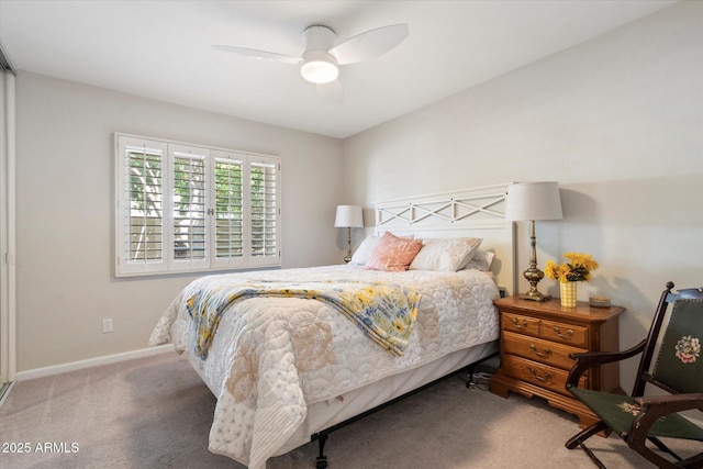 bedroom featuring baseboards, a ceiling fan, and carpet flooring