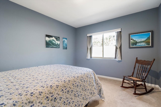 bedroom featuring baseboards and light carpet