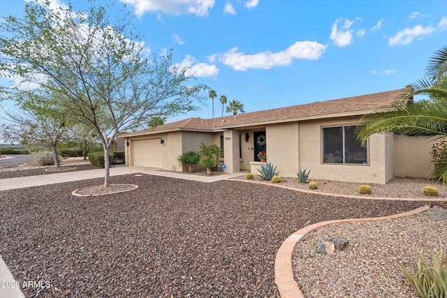 single story home with stucco siding, roof with shingles, concrete driveway, and an attached garage