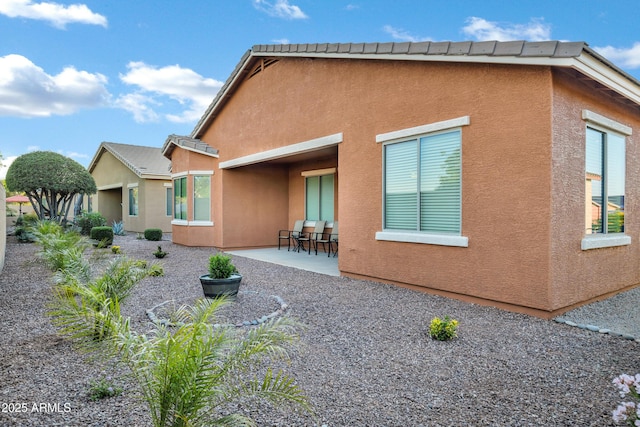 42335 W Waterfall Way, Maricopa, AZ 85138 - rear view of property featuring a patio and stucco siding