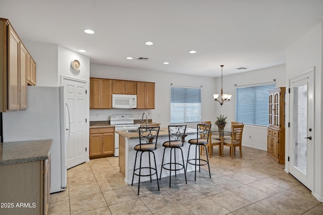 42335 W Waterfall Way, Maricopa, AZ 85138 - kitchen featuring visible vents, white appliances, a kitchen breakfast bar, recessed lighting, and light tile patterned flooring