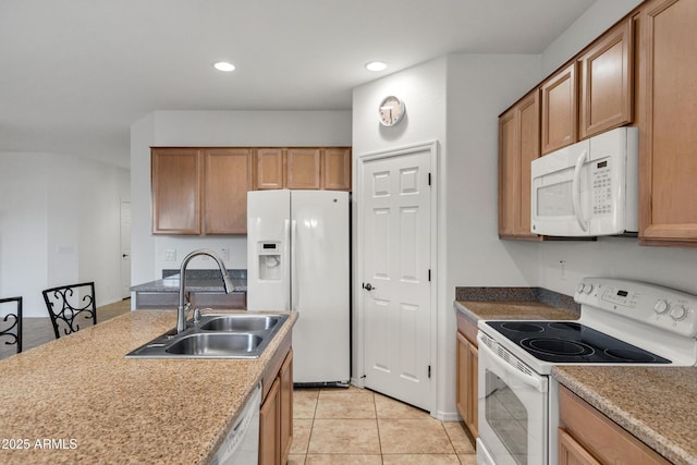 42335 W Waterfall Way, Maricopa, AZ 85138 - kitchen featuring recessed lighting, white appliances, light tile patterned floors, brown cabinets, and a sink