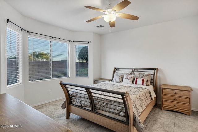 42335 W Waterfall Way, Maricopa, AZ 85138 - bedroom with light tile patterned floors, visible vents, baseboards, and ceiling fan