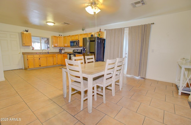 505 W 13th St, Casa Grande, AZ 85122 - dining room featuring ceiling fan and light tile patterned flooring